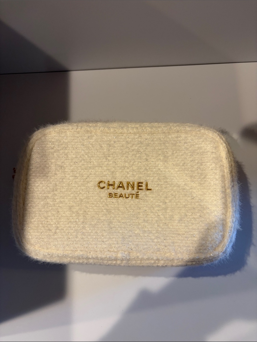 CHANEL Cream Wool Cosmetic Pouch with Gold Logo